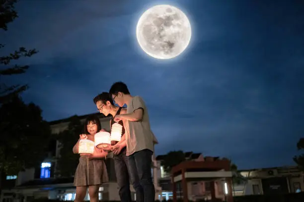 An Asian family celebrating a cultural festival like Lunar New Year