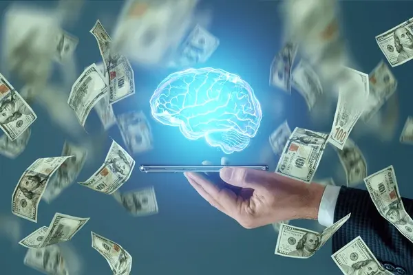 An image showing a brain connected to financial symbols like dollar signs and charts