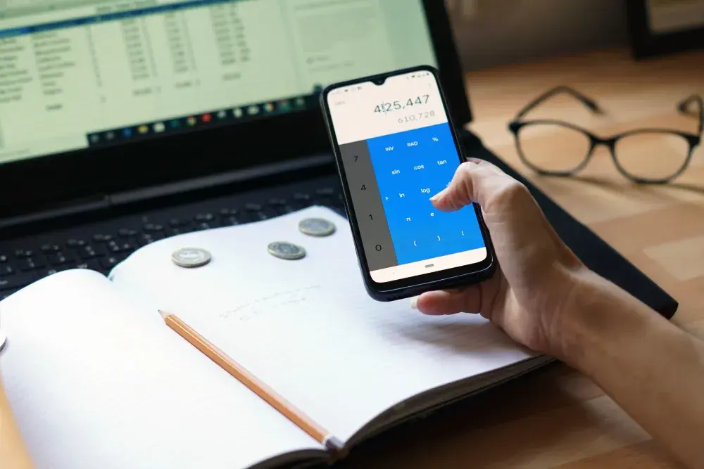 A person using a budgeting app on their smartphone that mimics digital envelopes