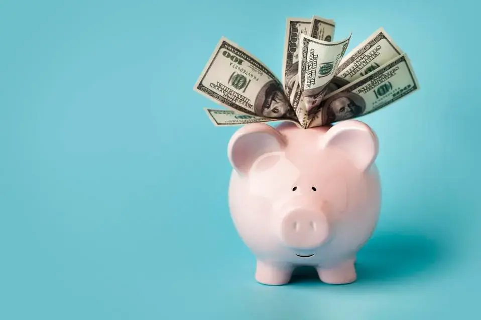 A person setting up an automatic savings plan on their phone